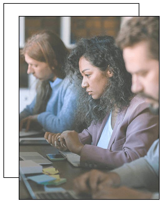 Image of professionals working in an office setting, representing a New York City law firm specializing in employment law and defense attorney services.